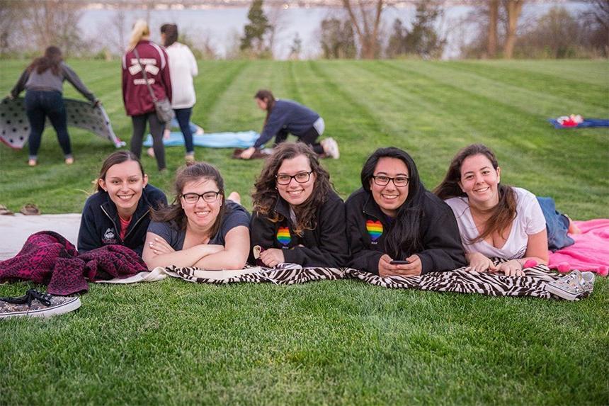 Students laying on the quad